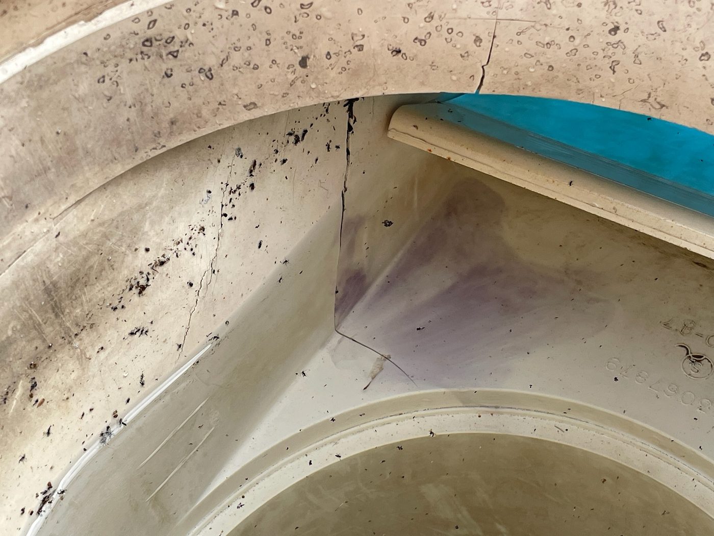 Cracked skimmer throat found on a leak call